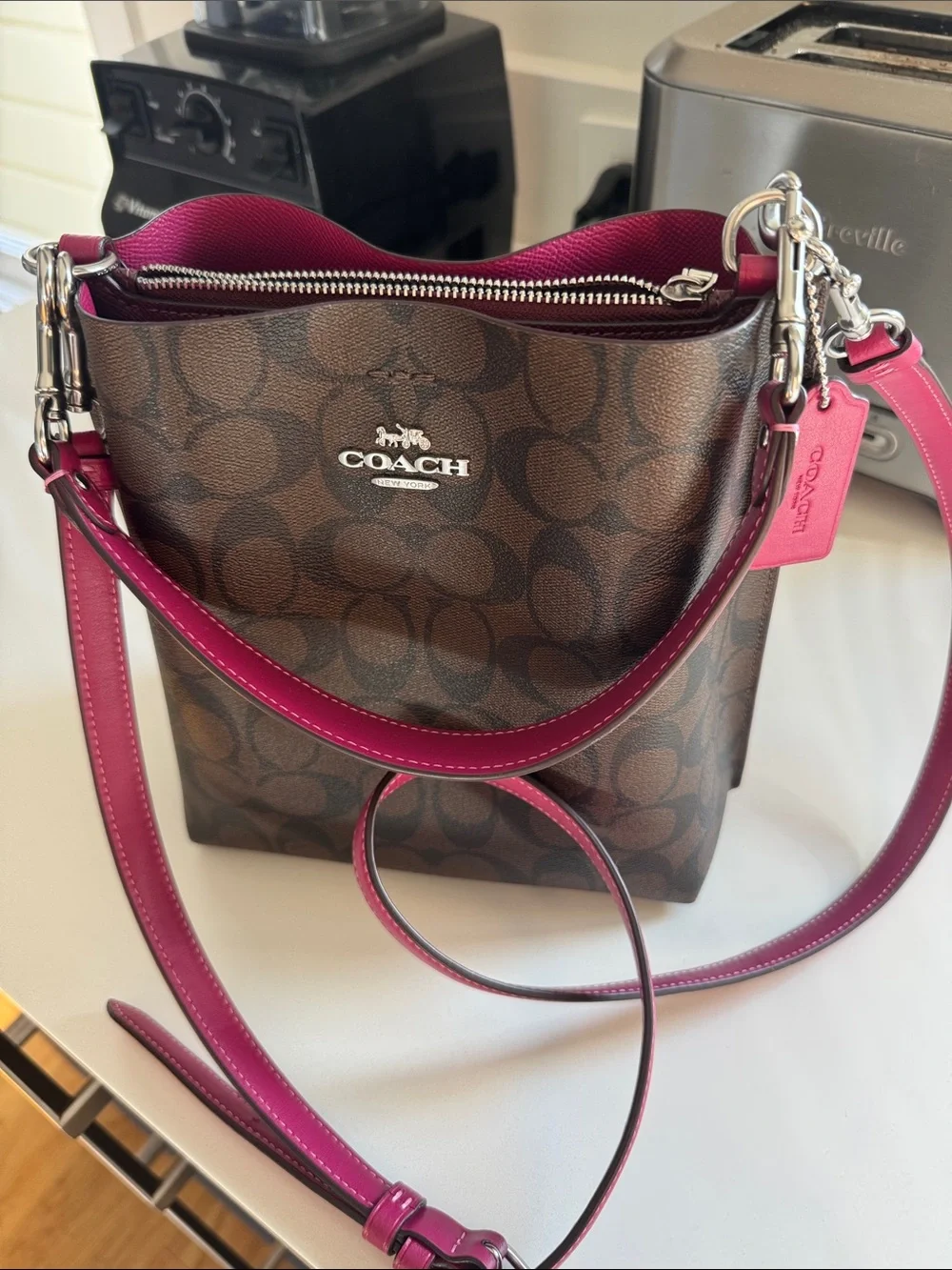 COACH Mollie monogram Bucket bag 22 in signature brown canvas with berry trim